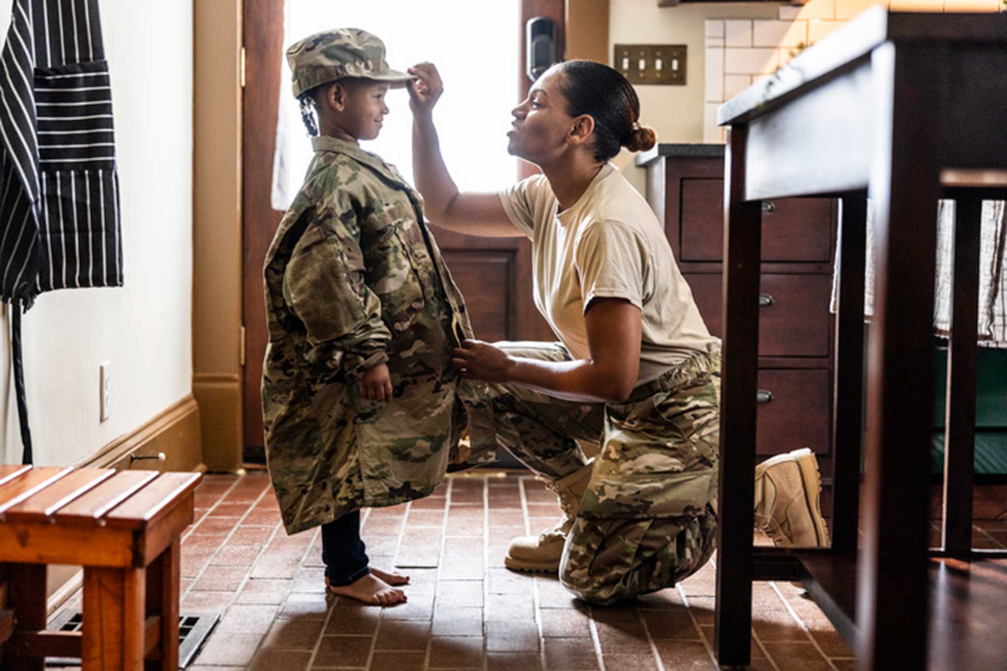 Soldier and his daughter walk hand in hand Soldier and his daughter walk hand in hand